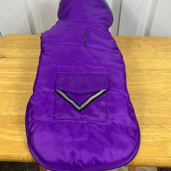 Purple with grey lining dog jacket size small. Has 2 velcro straps. Pocket front - Picture 3 of 5